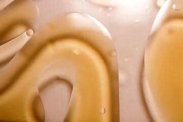 Abstract image of air bubbles and golden oil drip texture.