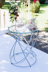 Glass top table with flowers in wedding