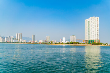 The city is from a distance from the sea.
Nha Trang city in Vietnam. View of the city from the sea.