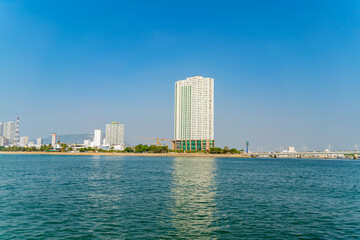 Fototapeta premium The city is from a distance from the sea. Nha Trang city in Vietnam. View of the city from the sea.