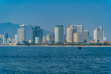 Fototapeta premium The city is from a distance from the sea. Nha Trang city in Vietnam. View of the city from the sea.