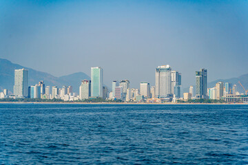 Naklejka premium The city is from a distance from the sea. Nha Trang city in Vietnam. View of the city from the sea.