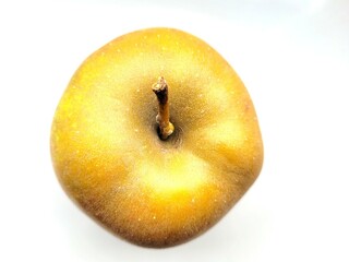 One green apple on a white background.