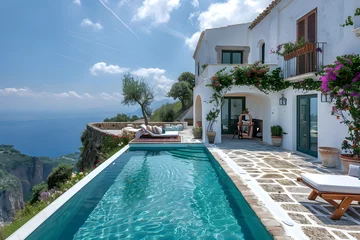 Foto op Canvas Traditional Mediterranean white house with a pool on a hill, overlooking the stunning sea view. Perfect for summer vacation background. © NE97