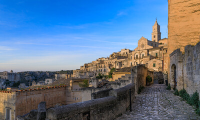 Skyline of the Sassi of Matera from typical hallway, Italy: view of the the Cathedral.