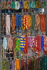 Colorful art and craft pearl beads jewelry on a market - 795627304