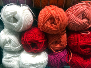 Large selection of colored threads for embroidery floss and cross stitch. Large set of colored threads for needlework.