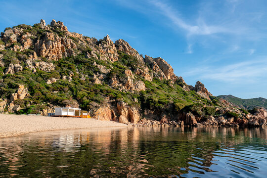 Serene Sardinian Beach with Rugged Hillside Scenery, Li Cossi beach