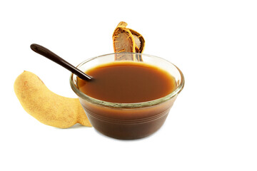 Tamarind fruit with tamarind water concentrate chutney pulp or paste for indian gujarati food panipuri,golgappa,rasam,dal,soup,chutny,paste,sarbat,cutout in transparent background,png format