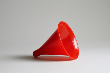 Red Plastic Funnel on a White Background