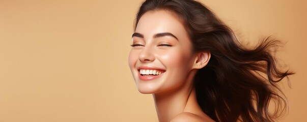 Closeup portrait of a joyful young model with a beaming smile, highlighting vibrant happy emotions, isolated on a light background