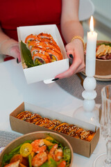 Sushi, friends and restaurant cheers with champagne for birthday celebration or social event. Celebrate toast, happy and smile of women with japanese food eating and drinking together with alcohol
