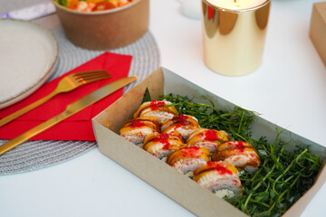 Sushi roll Philadelphia with salmon, smoked eel, avocado, cream cheese on black background. Sushi menu. Japanese food.