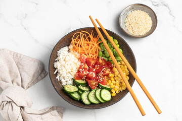 poke bowl with fresh cucumbers, carrots, edamame beans, corn, rice and sesame seeds, Bowl of...