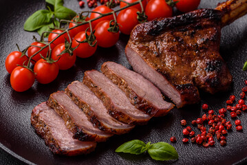 Delicious juicy beef steak on the bone, tomahawk with salt, spices and herbs
