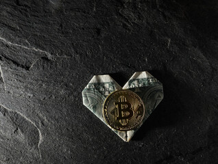  Gold crypto bitcoin on an origami dollar heart