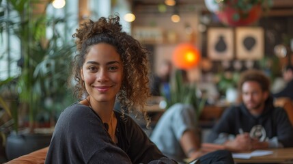 Portrait of a warm and inviting woman smiling in a cozy café with a comfortable ambiance