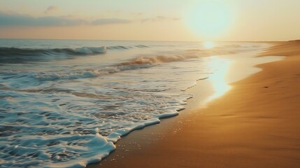 A serene beach at sunset, with waves gently lapping against the shore. - obrazy, fototapety, plakaty