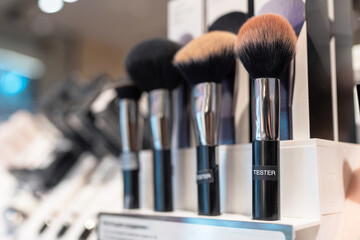 Make up counter in department store. Makeup sample test brushes