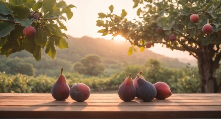 Fresh raw figs fruits on wooden table, field garden in background.