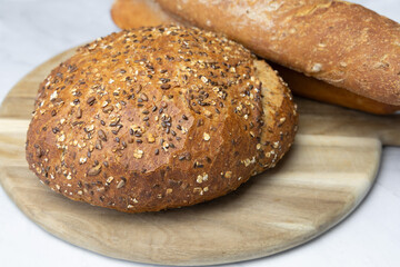 Freshly baked bread on a cutting board.