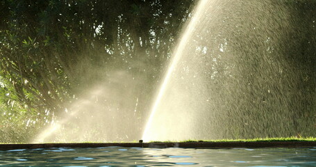 Water sprinkles watering lawn garden irrigation
