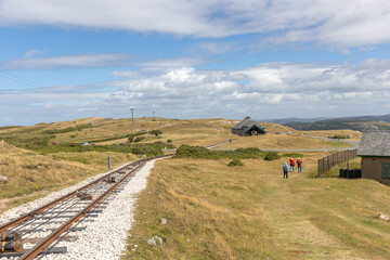 The Great Orme Tramway rail with the midway station in the distance - Llandudno, North Wales - obrazy, fototapety, plakaty