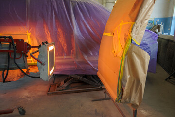 In the paint shop, the paint is dried with a heat lamp