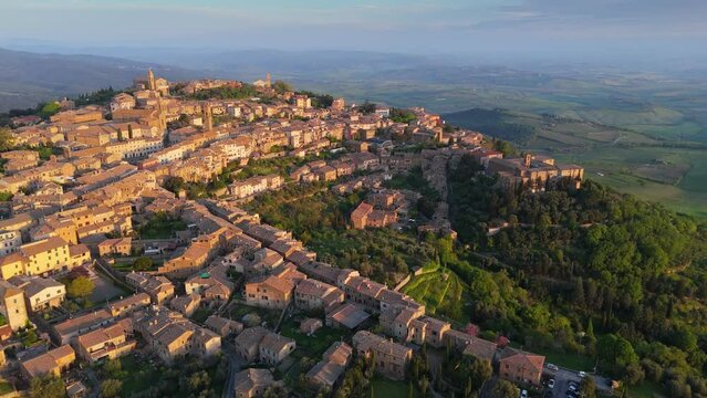 Morning flight over medieval Italian town Montalcino, Tuscany, Italy. UHD, 4K