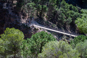 Fototapeta na wymiar Hiking trail to Colgante bridge (Puente Colgante El Saltillo) over Almanchares river, Sierra Tejeda, Andalusia, Spain