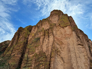 Fototapeta premium View from a steamboat, of Canyon Lake reservoir and rock formations in Maricopa County, Arizona in the Superstition Wilderness of Tonto National Forest near Apache Trail. The lake was formed by dammi