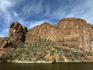 View from a steamboat, of Canyon Lake reservoir and rock formations in Maricopa County, Arizona in the Superstition Wilderness of Tonto National Forest near Apache Trail.  The lake was formed by dammi