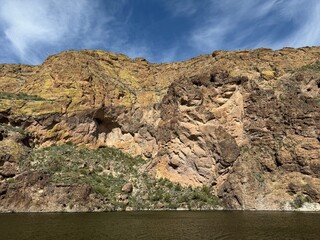 Fototapeta na wymiar View from a steamboat, of Canyon Lake reservoir and rock formations in Maricopa County, Arizona in the Superstition Wilderness of Tonto National Forest near Apache Trail. The lake was formed by dammi