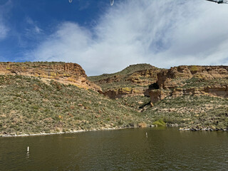 View from a steamboat, of Canyon Lake reservoir and rock formations in Maricopa County, Arizona in the Superstition Wilderness of Tonto National Forest near Apache Trail.  The lake was formed by dammi