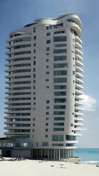 The high - rise building of the hotel in the constructivist style on the seashore,
