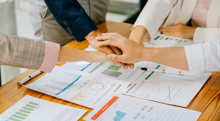 Business people shake hands with business partners at a meeting. The concept of organizational...