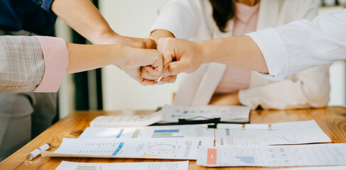 Business people shake hands with business partners at a meeting. The concept of organizational...