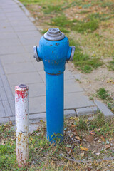 Blue Pipe High Pressure Water Fire Hydrant in City Park