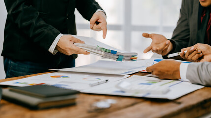 Team of business people working together in the meeting room office, teamwork background charts and...