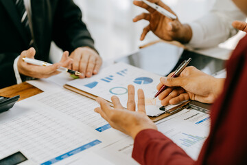 Team of business people working together in the meeting room office, teamwork background charts and...