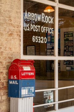 Arrow Rock, MO, USA - April 22, 2024: US Post Office with a mail box.