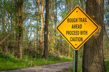 rough trail ahead, proceed with caution - warning sign on Steamboat Trace Trail converted from old railroad near Peru, Nebraska
