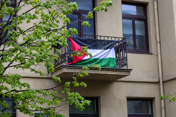 Syrian flag in the city of Kaunas, on the balcony. Lithuania - obrazy, fototapety, plakaty