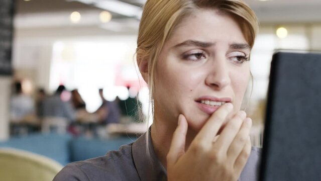 Business, stress and woman with tablet at a cafe with scam notification, mistake or 404 and error. Anxiety, oops and female entrepreneur with digital app disaster, glitch crisis or investment fail