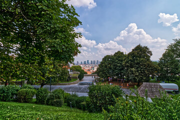 Fototapeta na wymiar View of the downtown seen between the trees from the castle, Bratislava, Slovakia