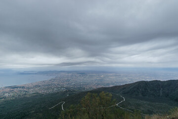 View from the top of Mount Vesuvius down to the city on a cloudy winter day, Naples, Campania, Italy