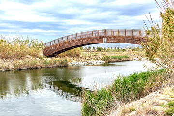 wooden bridge crossing river
