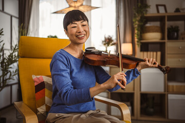 Mature japanese woman have online class learn how to play violin