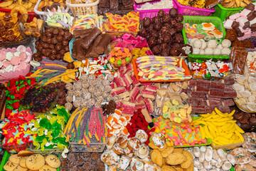 Sweets in a wide variety of flavors, shapes, colors and traditional preparation methods are displayed on numerous stands during the Catholic celebration of Corpus Christi in Cuenca, Ecuador