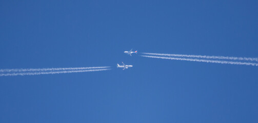 Two Commercial Airliners Pass Each Other at High Altitude